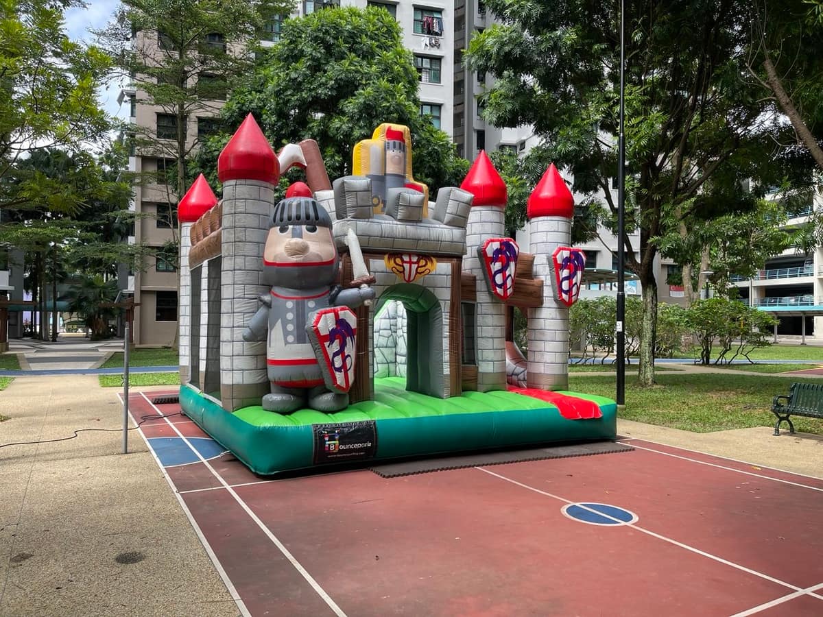 Bouncy castle set up in an HDB courtyard